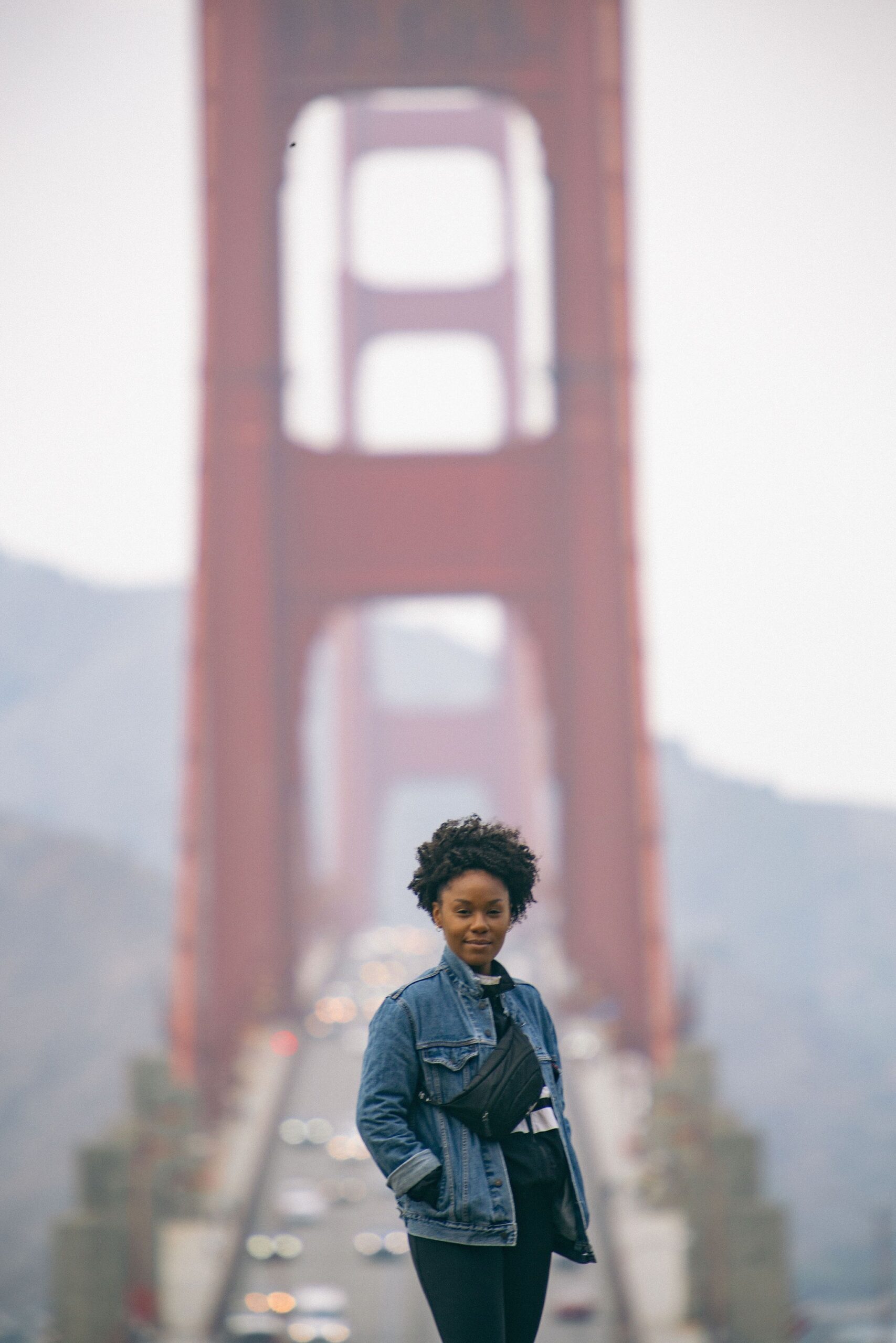 Black woman standing in front of the Golden Gate Bridge