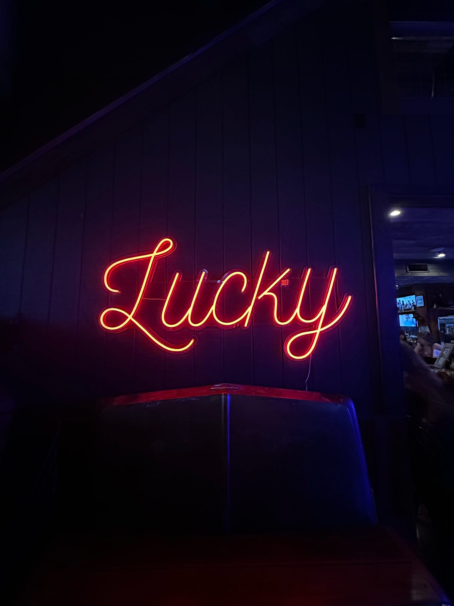 A neon sign of The Lucky Rabbit. A dive bar in Jamestown, Texas near Lake Travis.